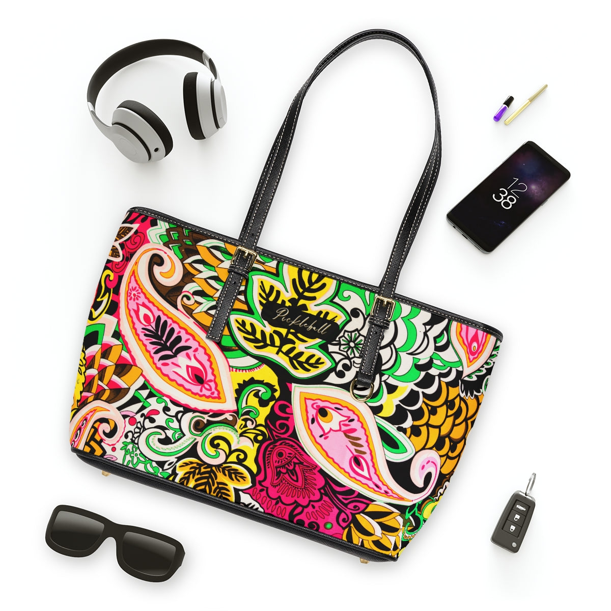 Bright Paisley Shoulder Bag surrounded by accessories